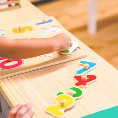 boy playing with bilingual learning toy