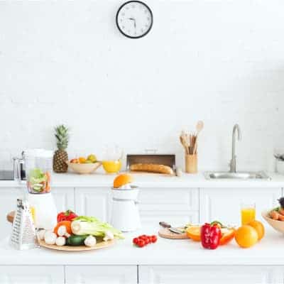 white kitchen with fruits and vegetables for easy plant based transition