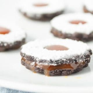 chocolate caramel sandwich cookies on plate closeup