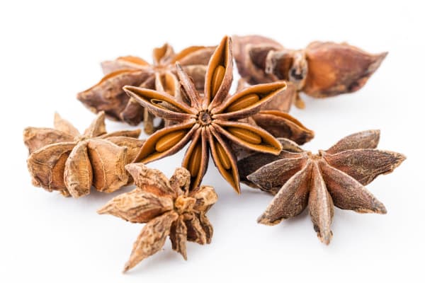 closeup of star anise seed spice on white background