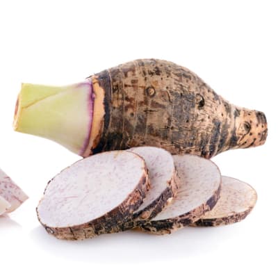 whole tarro root closeup with tarro chip slices