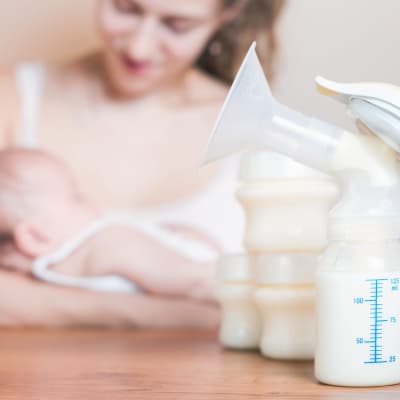 baby sleeping after drinking pumped breast milk
