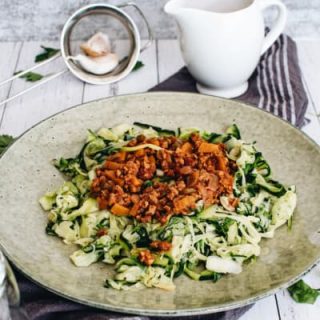 closeup of vegan zucchini bolognese on plate