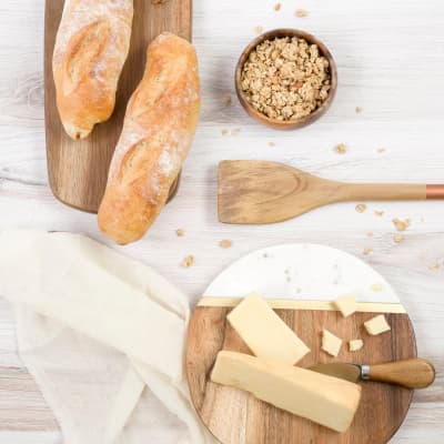 bread and cheese board on wooden plates