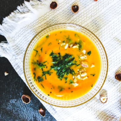 overhead view of bowl of vegan pumpkin soup