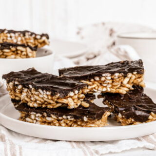 chocolate puffed rice bars stacked on plate
